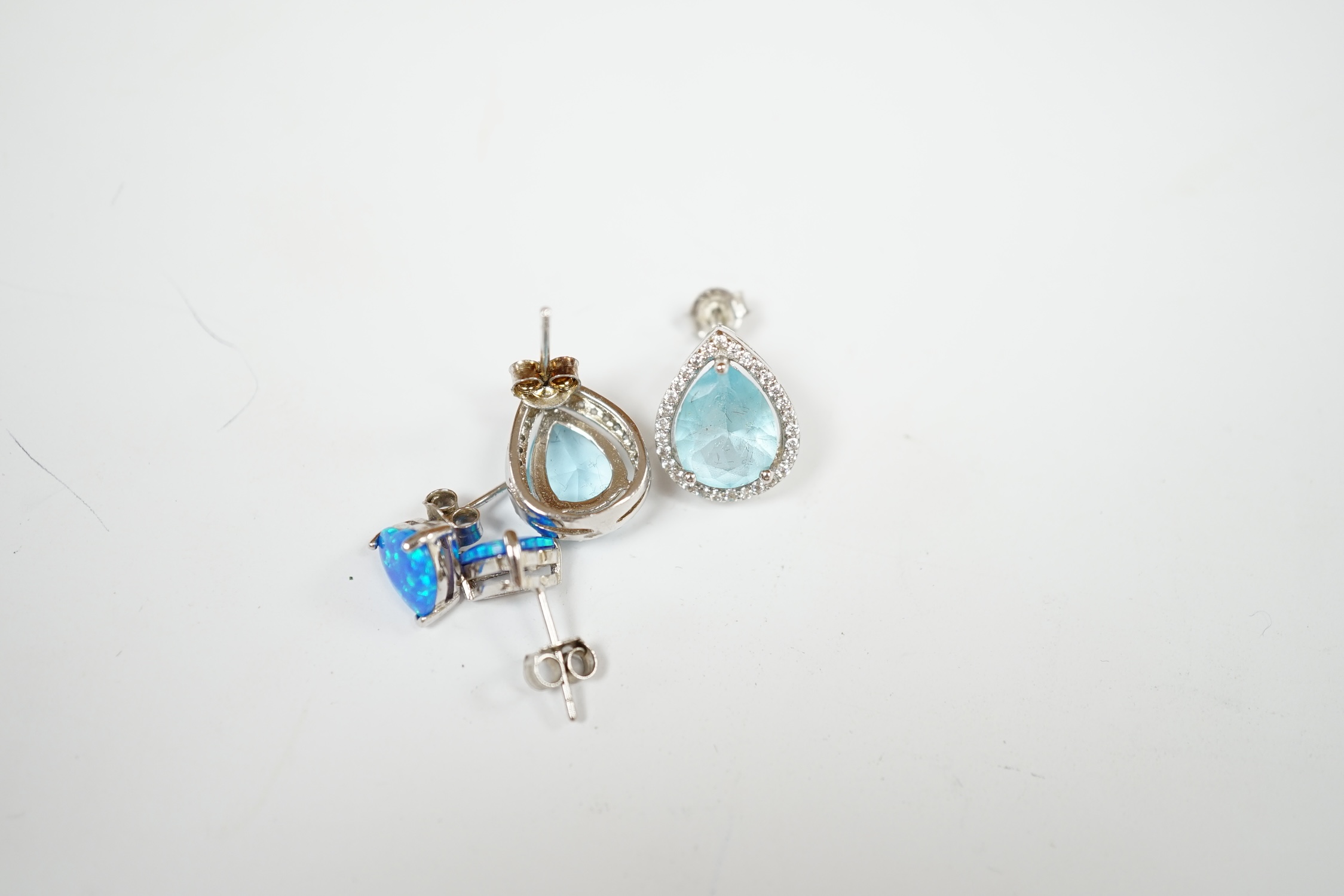 A modern 925 and simulated diamond set line necklace, 41cm, and two pairs of 925 and simulated gemstone set ear studs. Condition - poor to fair